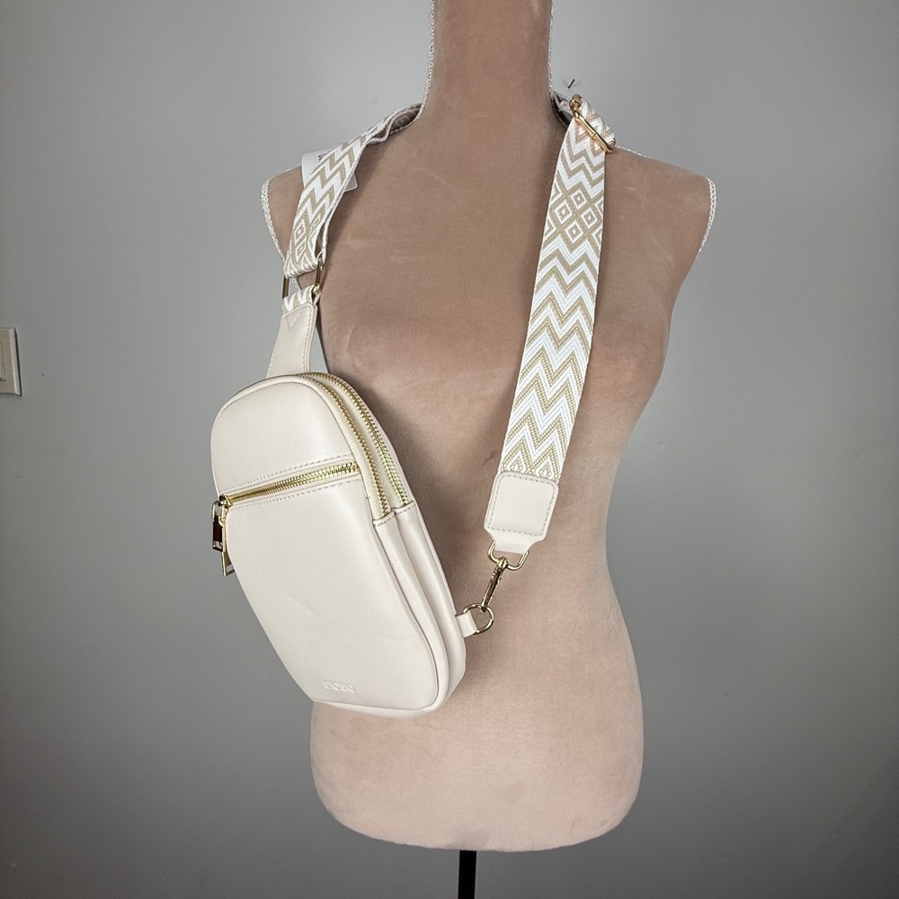 Elegant Cream Crossbody Bag with Patterned Strap